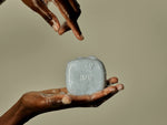 Beauty Disrupted luxury shampoo bars and solid soaps on the architectural stone TRIO holder.