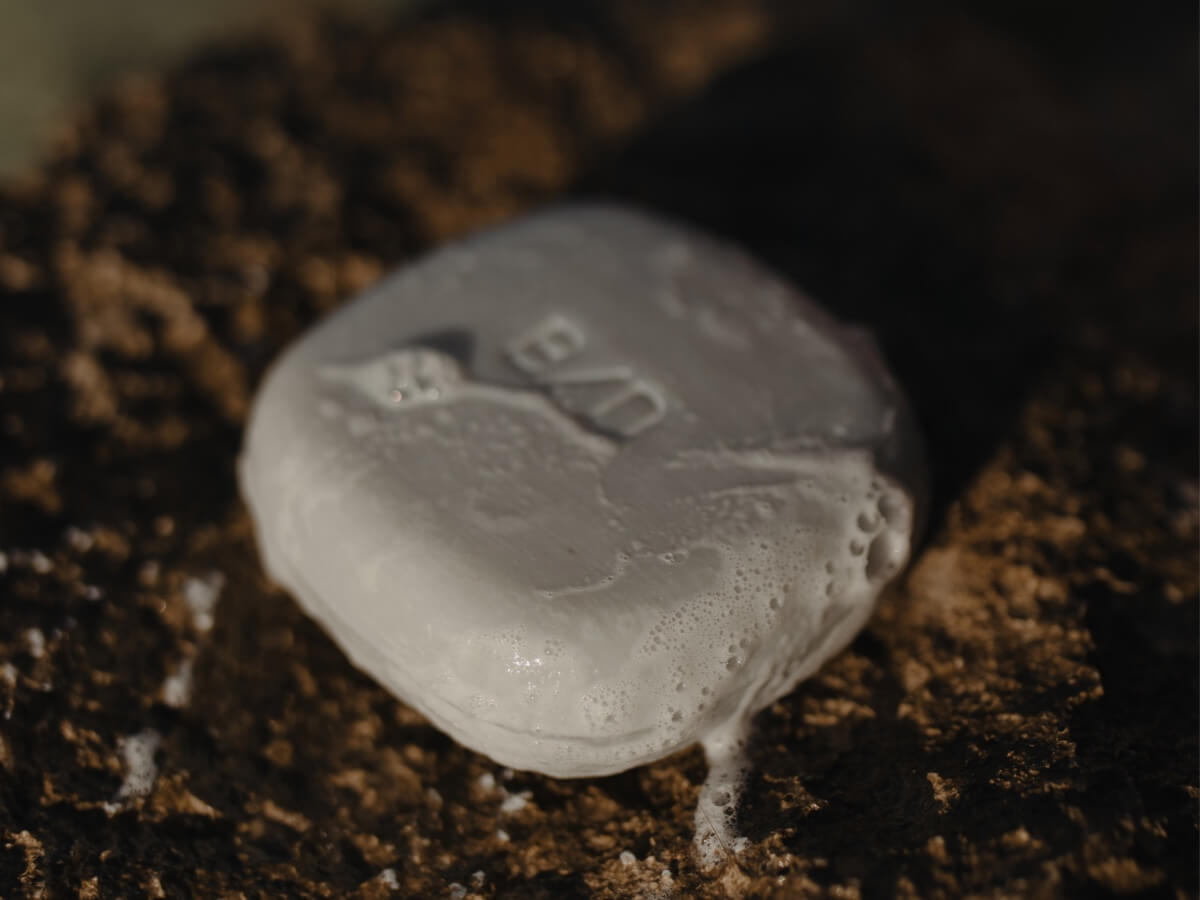 Beauty Disrupted luxury shampoo bars and solid soaps on the architectural stone TRIO holder.