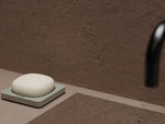 A hand-crafted ceramic holder designed to preserve the integrity and longevity of solid hand soap