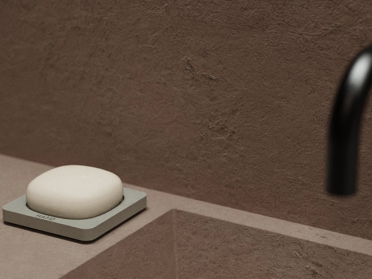 A hand-crafted ceramic holder designed to preserve the integrity and longevity of solid hand soap