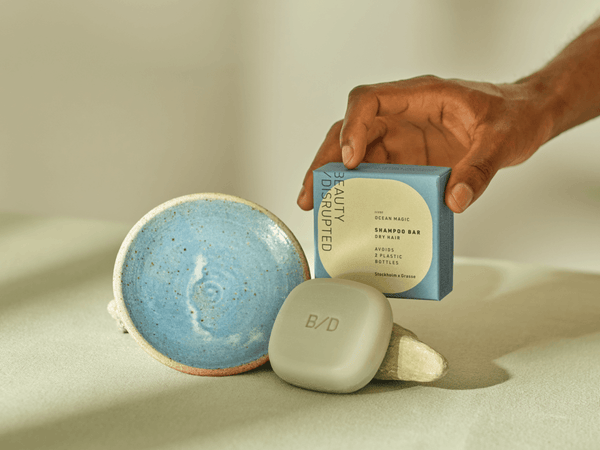 Beauty Disrupted luxury shampoo bars and solid soaps on the architectural stone TRIO holder.