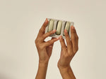 A high-density solid Body Treatment designed to purify gently while preserving the skin’s natural lipid balance.